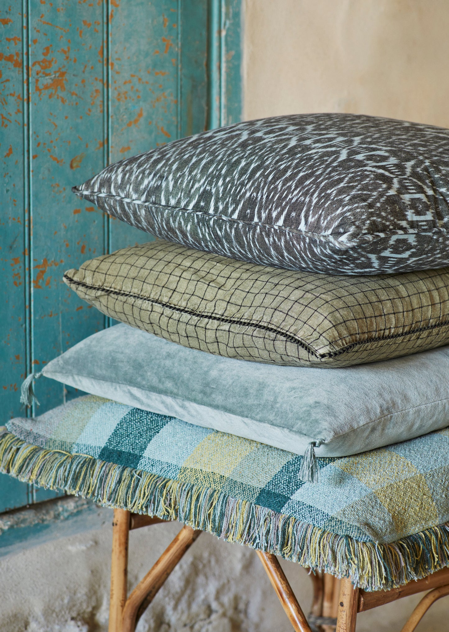 Velvet cushion cover with tassel detail in aqua | Minerva Interiors