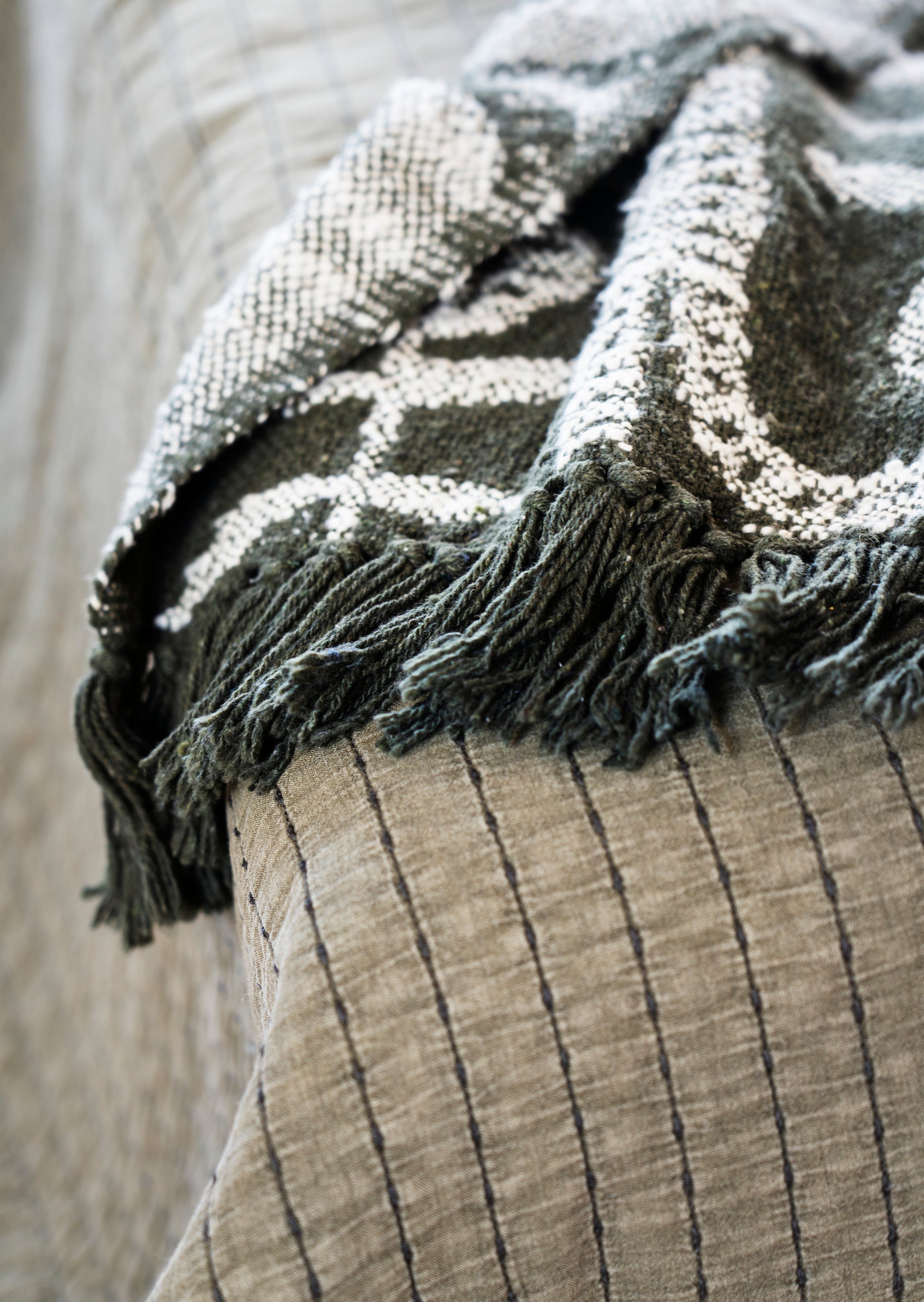 Quilted cotton bed cover and throw in khaki and dark green | Minerva Interiors