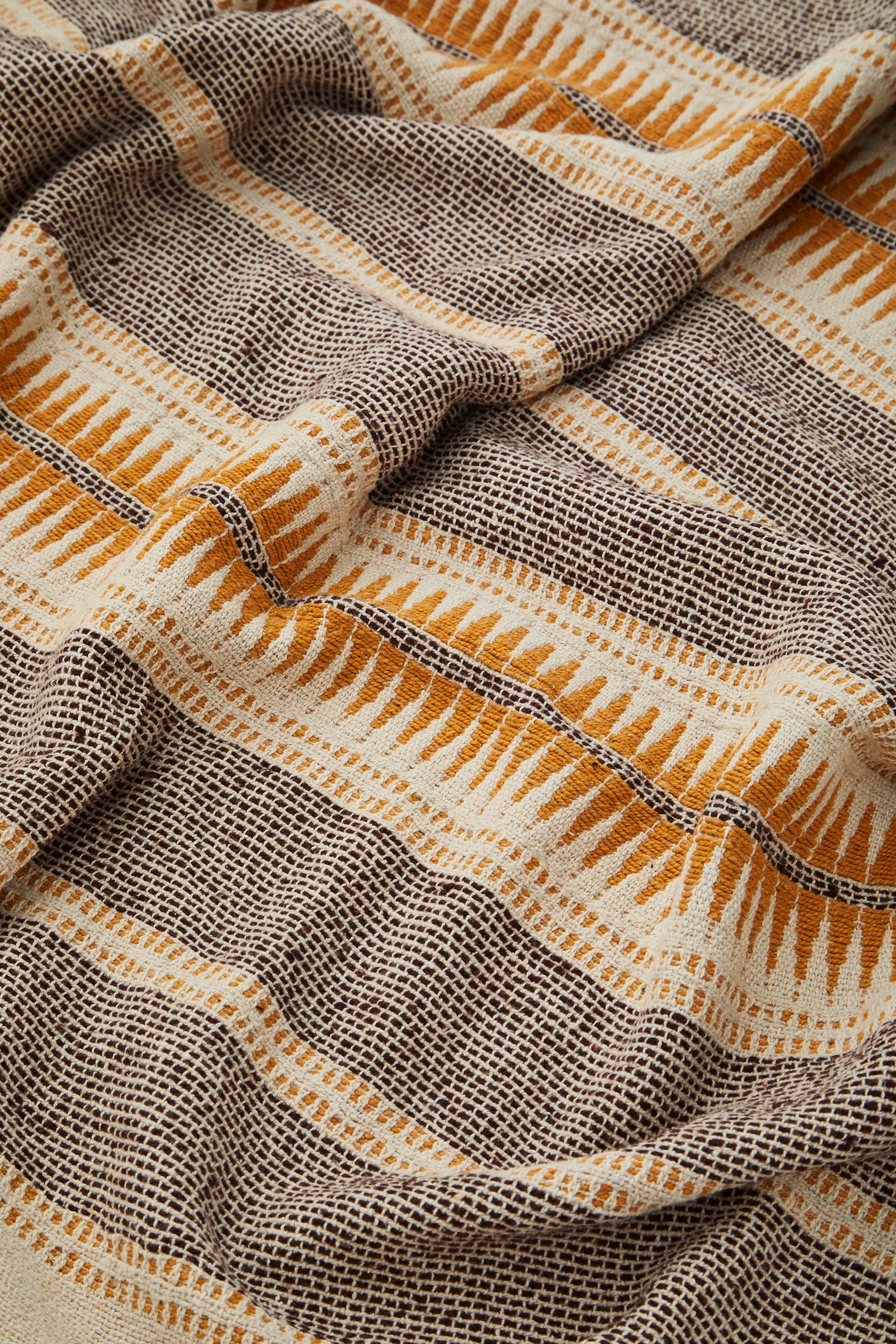 Cotton throw in ecru, brown and honey | Minerva Interiors
