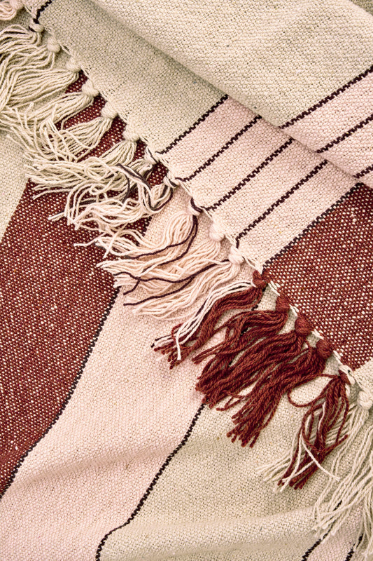 Cotton throw in off white, almond, light pink and black | Minerva Interiors