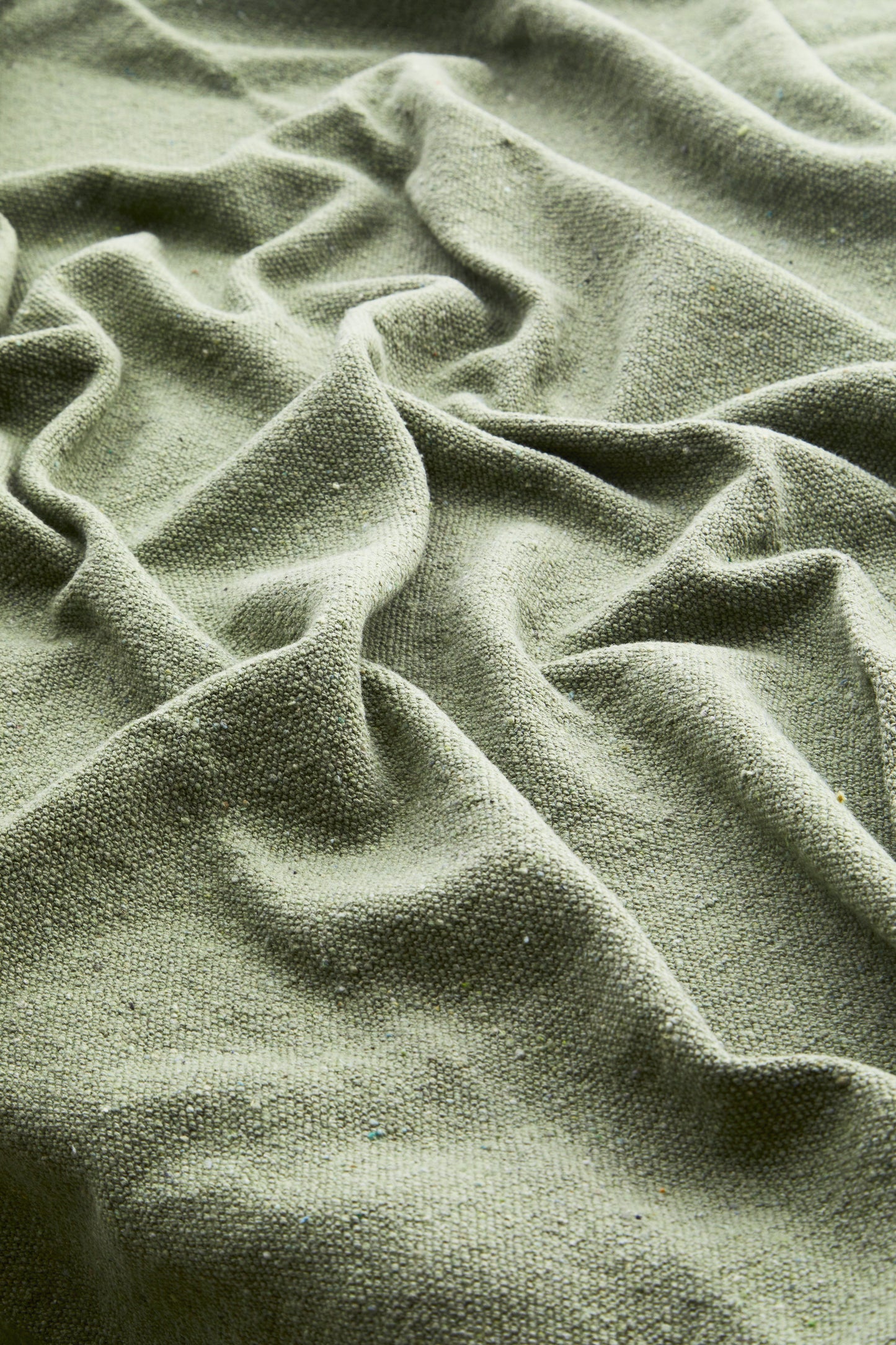 Cotton throw in dusty green | Minerva Interiors