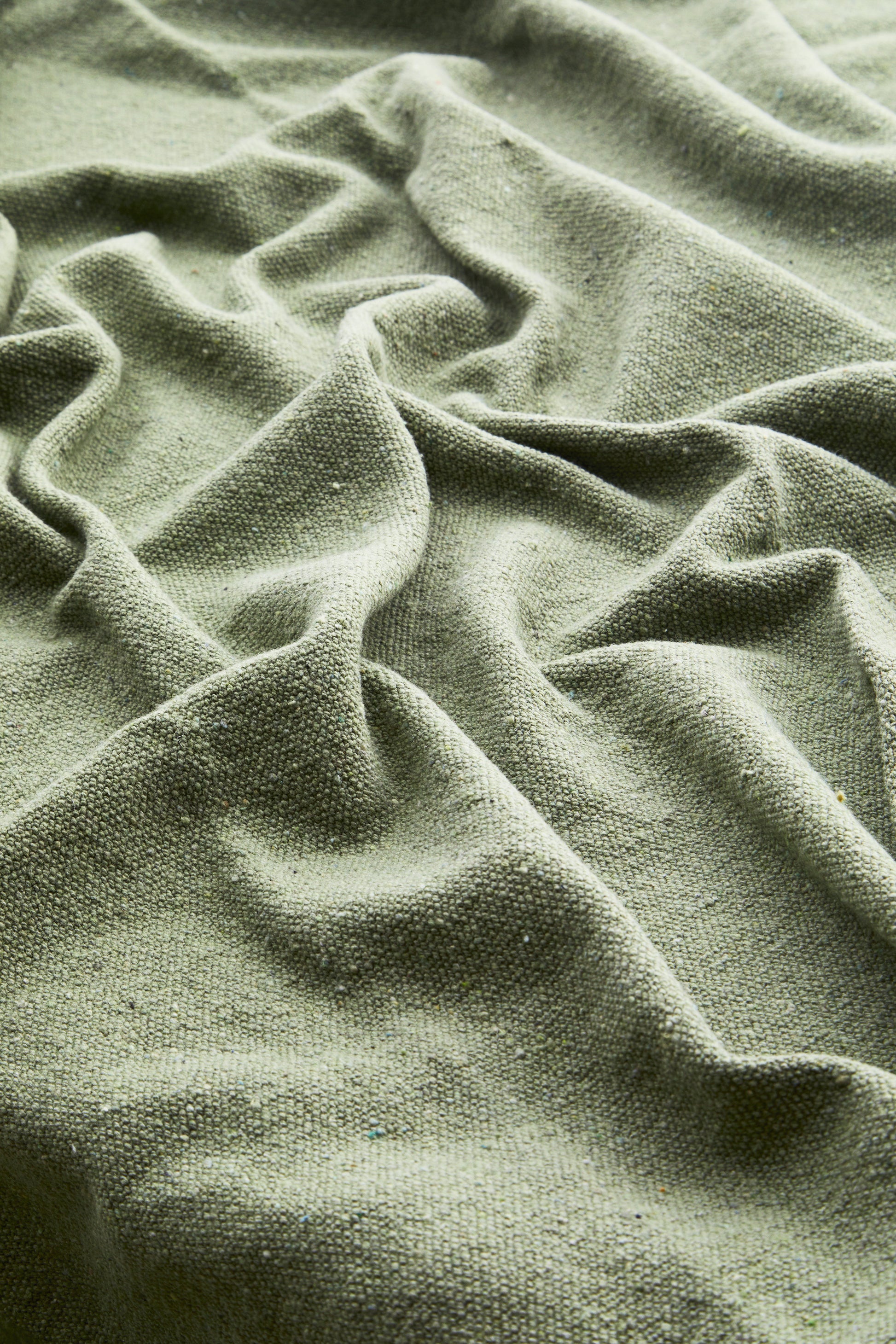 Cotton throw in dusty green | Minerva Interiors