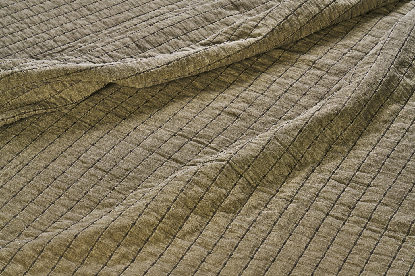 Quilted cotton bed cover and throw in khaki and dark green | Minerva Interiors