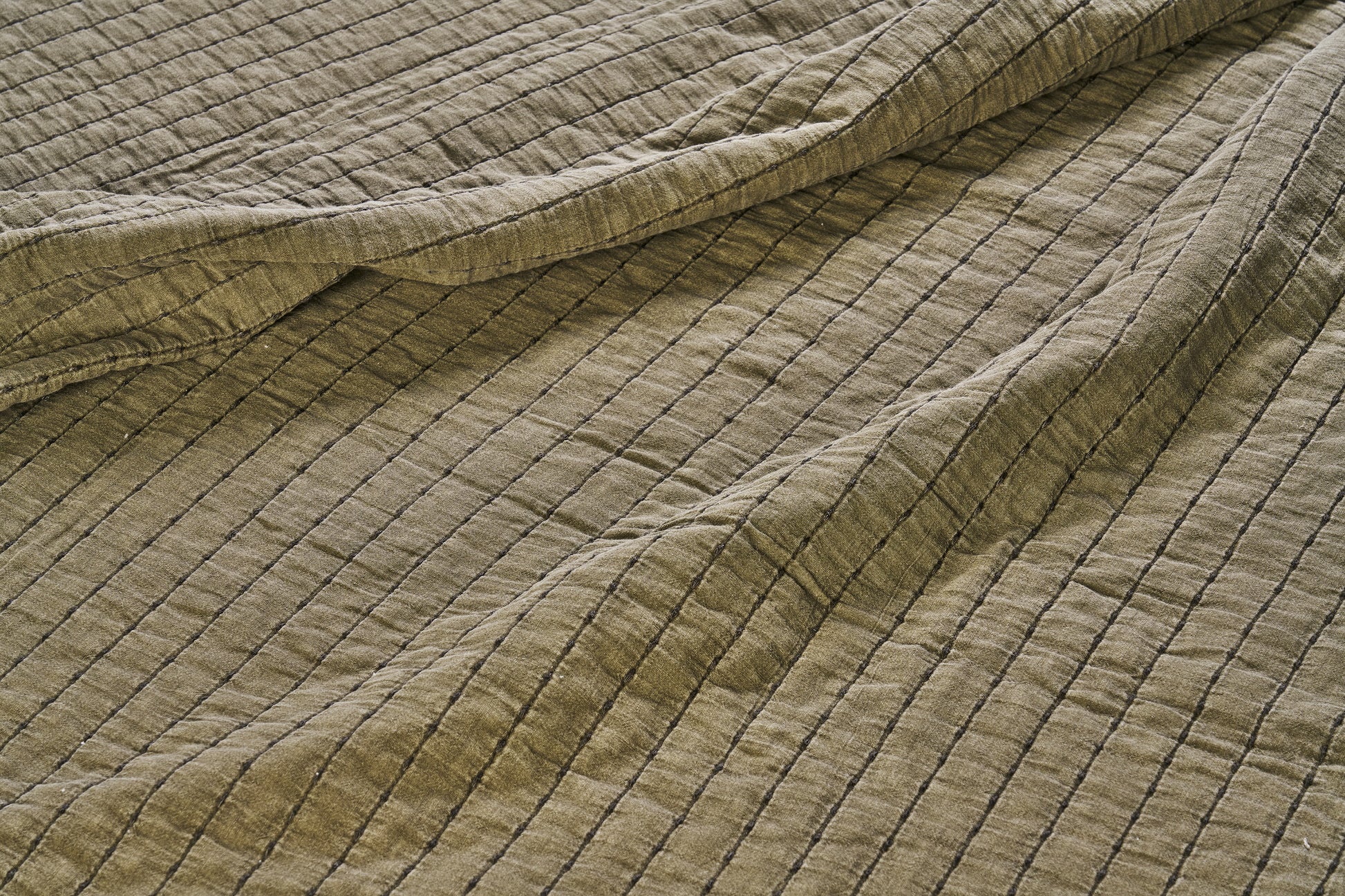 Quilted cotton bed cover and throw in khaki and dark green | Minerva Interiors