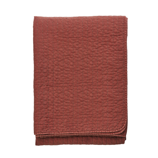 Quilted cotton bed cover and throw in brick and brown | Minerva Interiors
