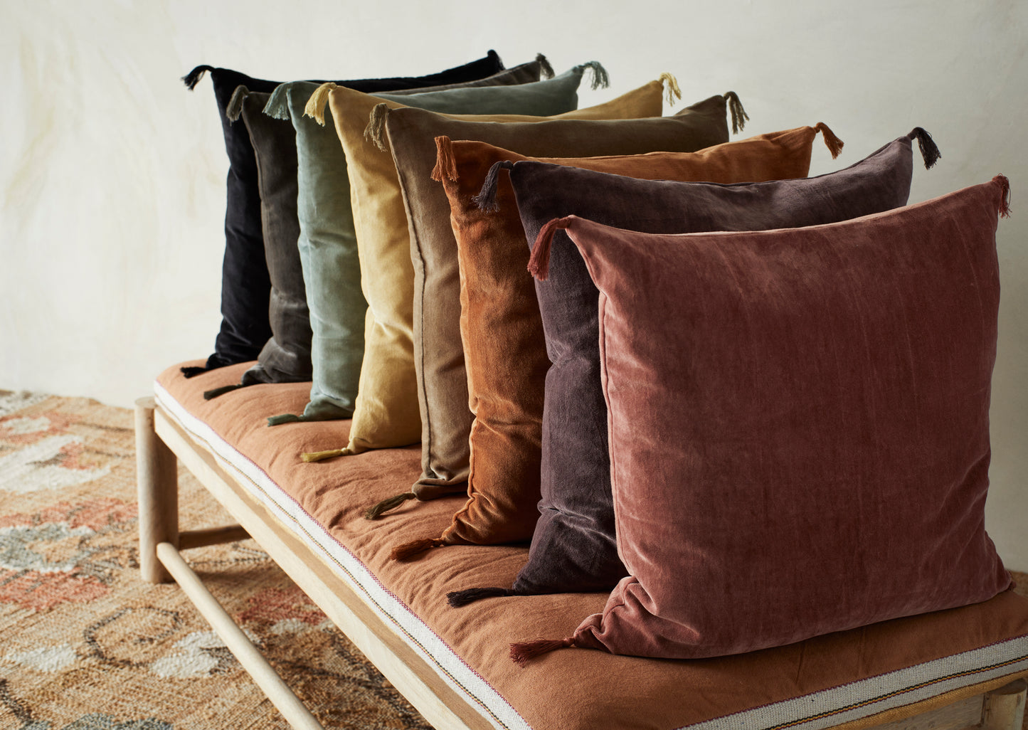 Velvet cushion cover with tassel detail in dark rose | Minerva Interiors